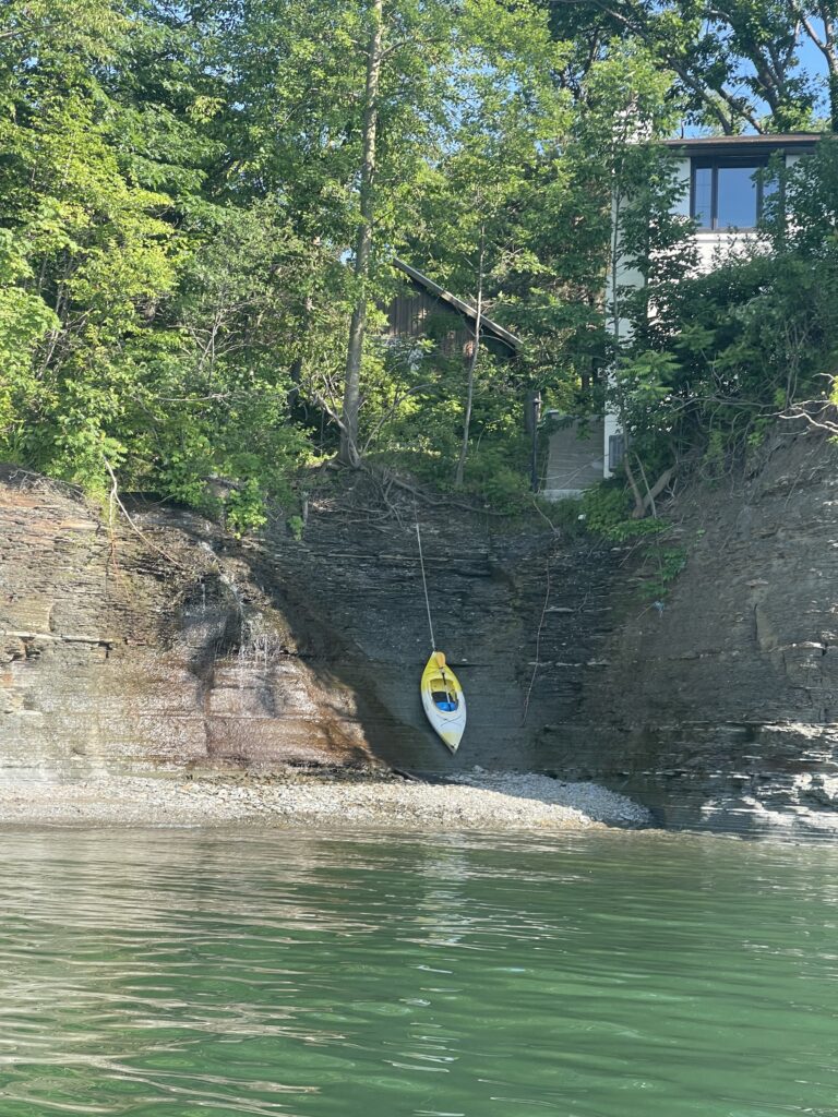 Lake Erie cove with a kayak suspended from a rope.  